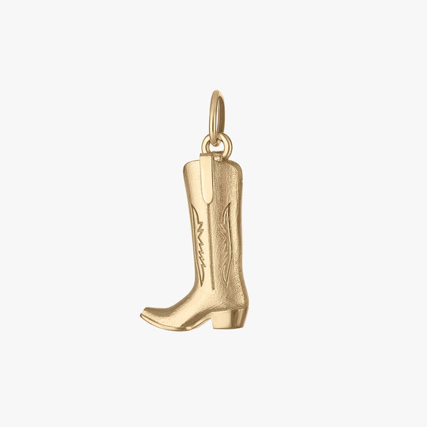 Gold cowboy boot charm on a white background