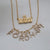 Fordham Keating Hall Necklace shown with Fordham Diamond Letters on Cable Chain in gold laydown