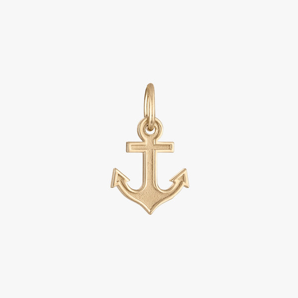 A gold anchor charm with a 3-D logo design.