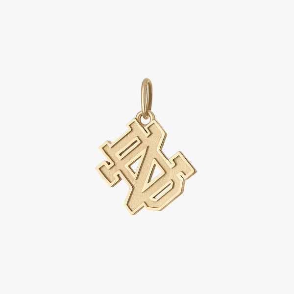 Gold pendant with a geometric design on a white background
