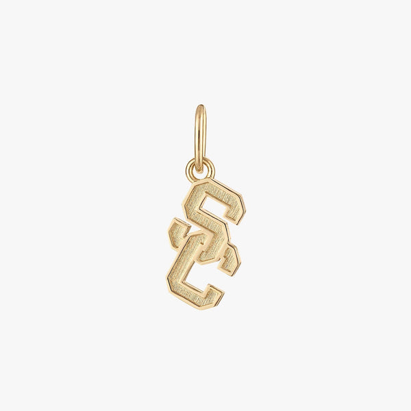 A gold charm in the shape of the USC logo.