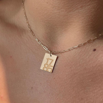 UGA 1785 Rectangle Pendant shown on figure in gold on Link Chain