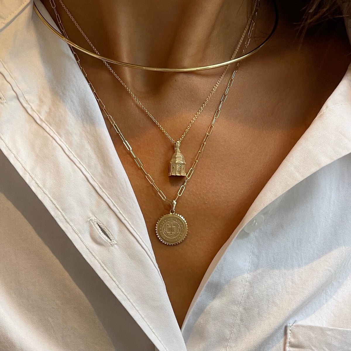 Notre Dame Sunburst Pendant on figure