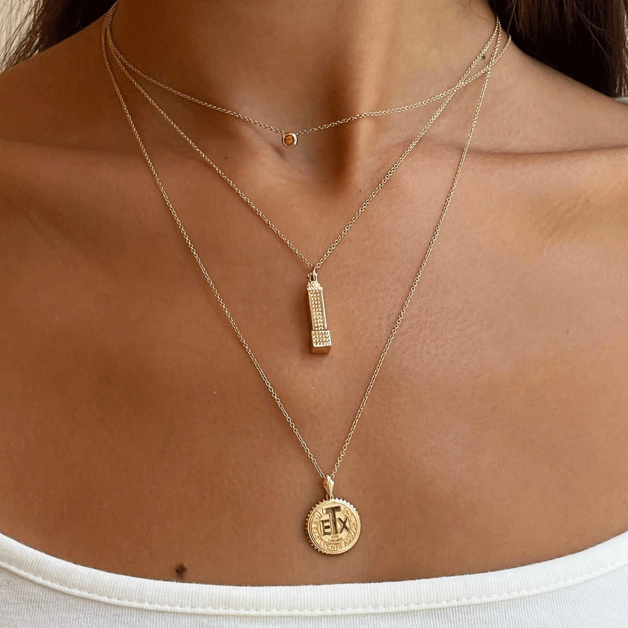 UT Tower Pendant on figure