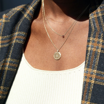 Ole Miss Eye Seal 7-Point Diamond Pendant shown on figure with Garnet Gemstone Necklace