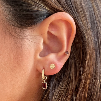Alpha Omicron Pi Rose Stud Earring shown on figure in gold