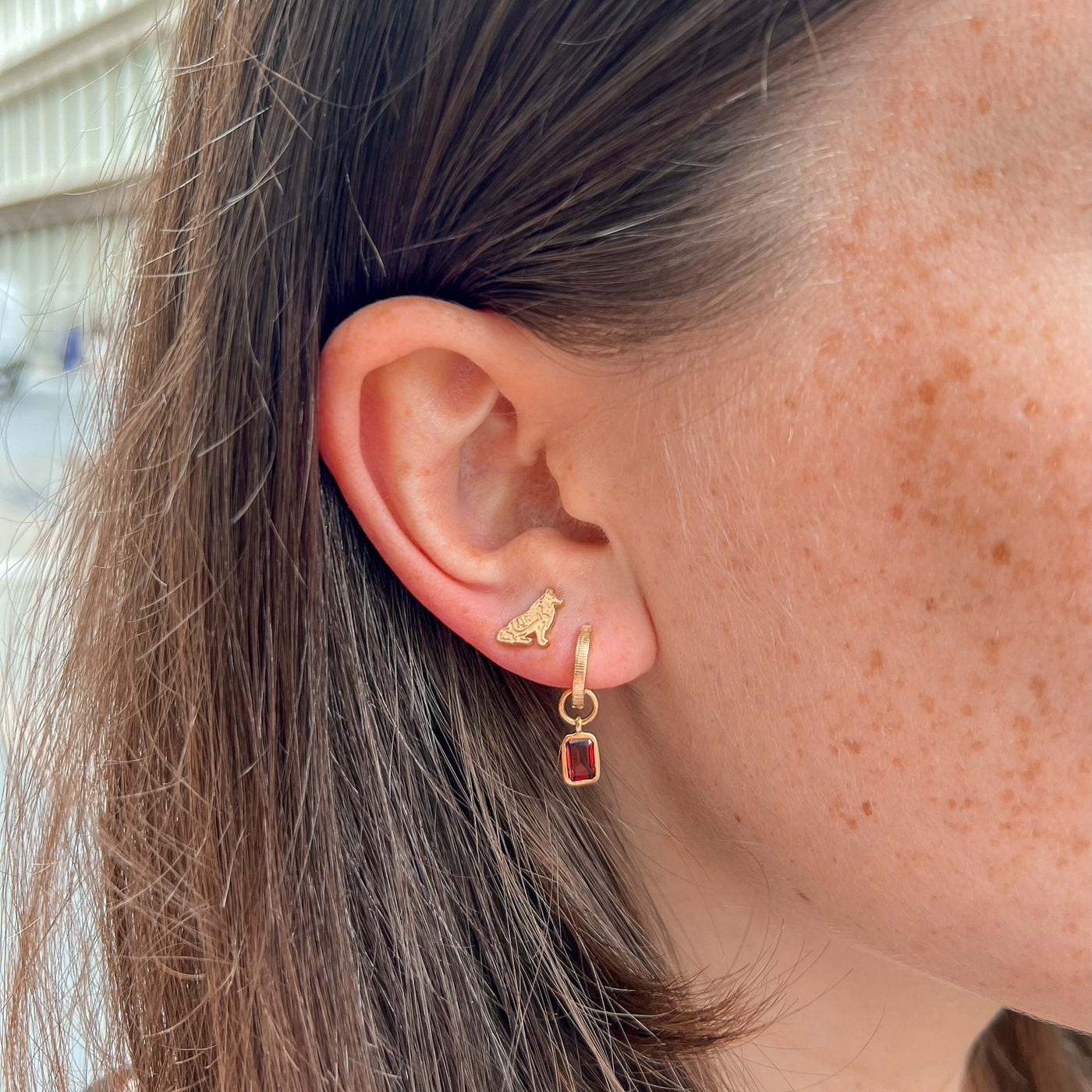 Texas A&M Reveille Stud Earring shown on figure in gold with Garnet Florentine Earring Bundle