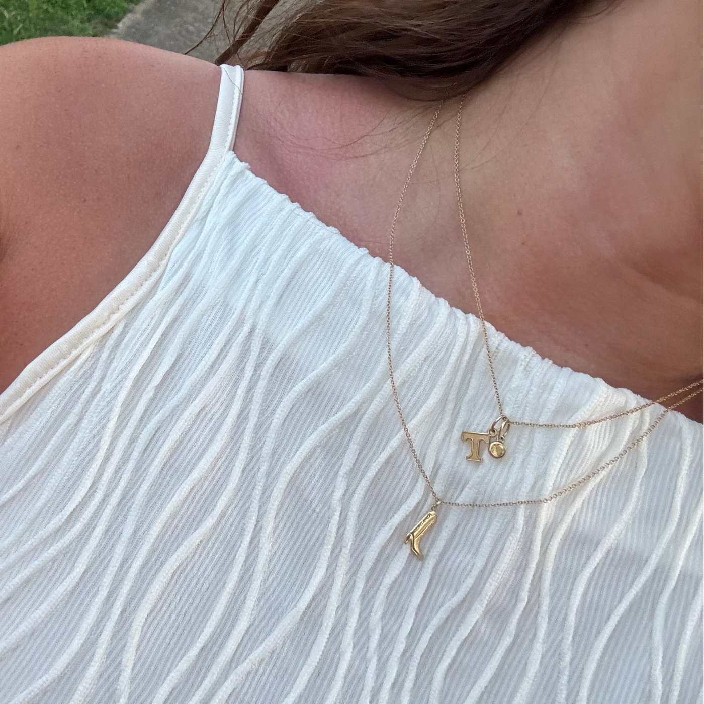 Tennessee T Letter Charm Bundle shown on figure in gold