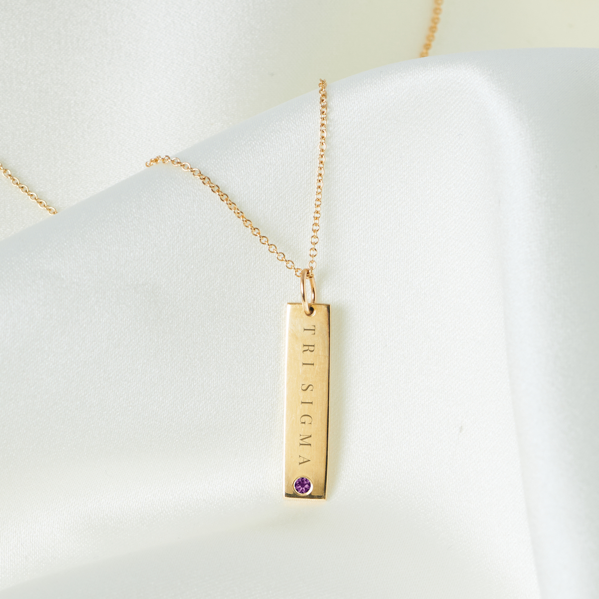 Tri Sigma Amethyst Gemstone Bar laydown shown in gold on cable chain