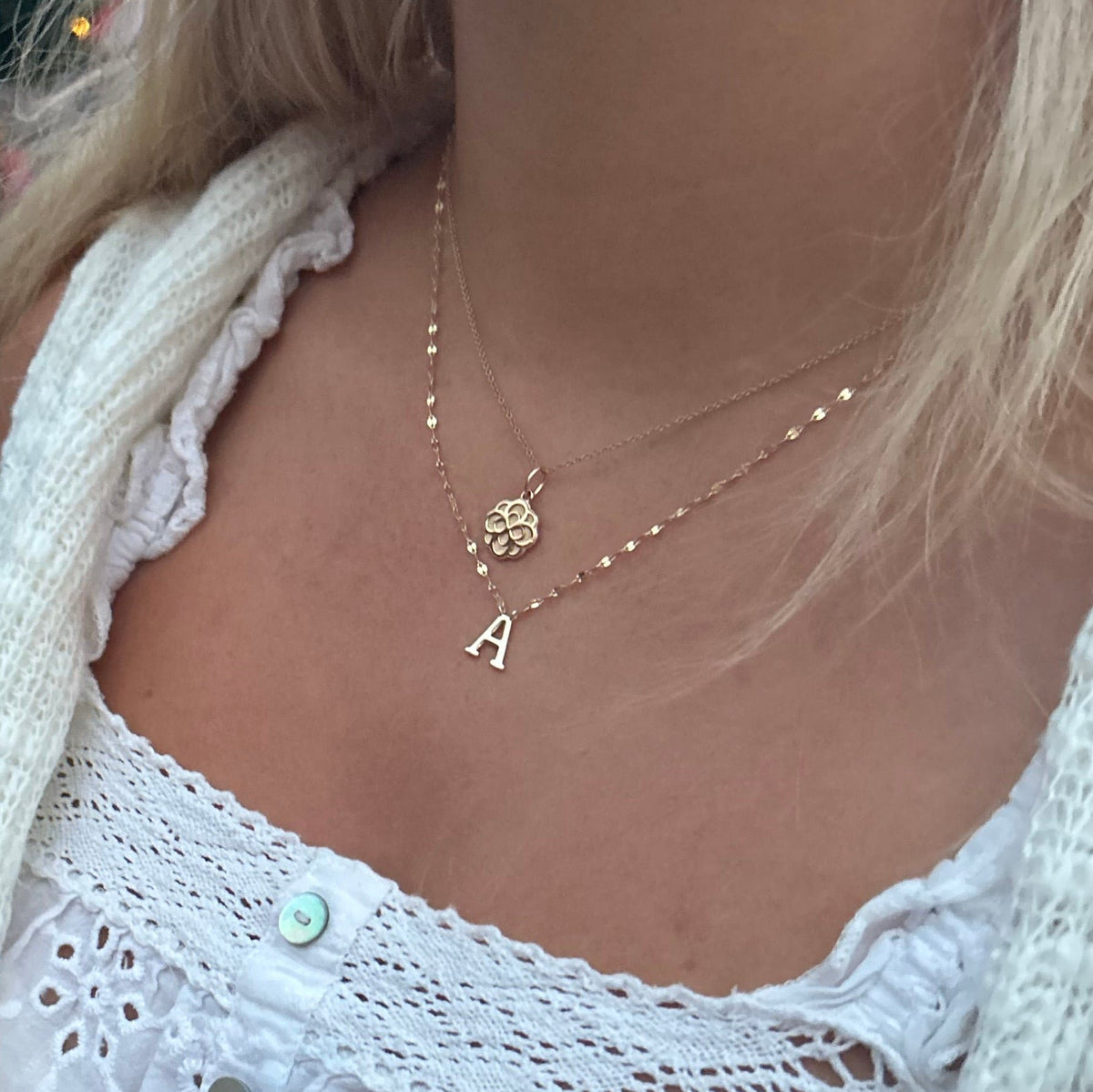 Alpha Omicron Pi Rose Charm shown on figure in gold with Cable Chain