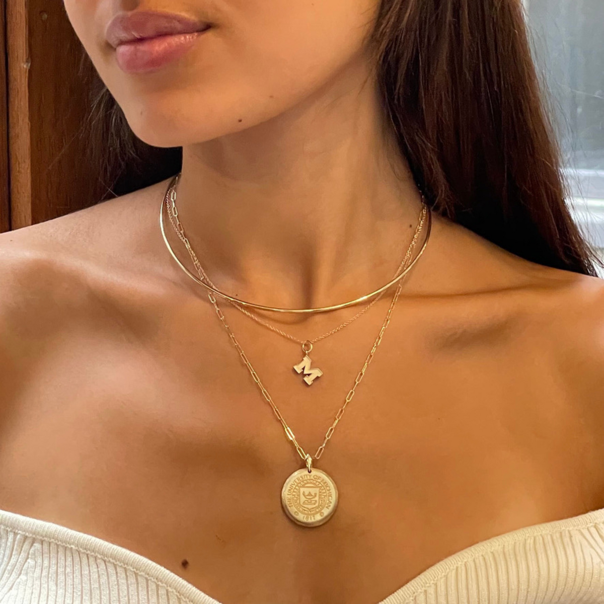 Michigan M Letter Charm on figure