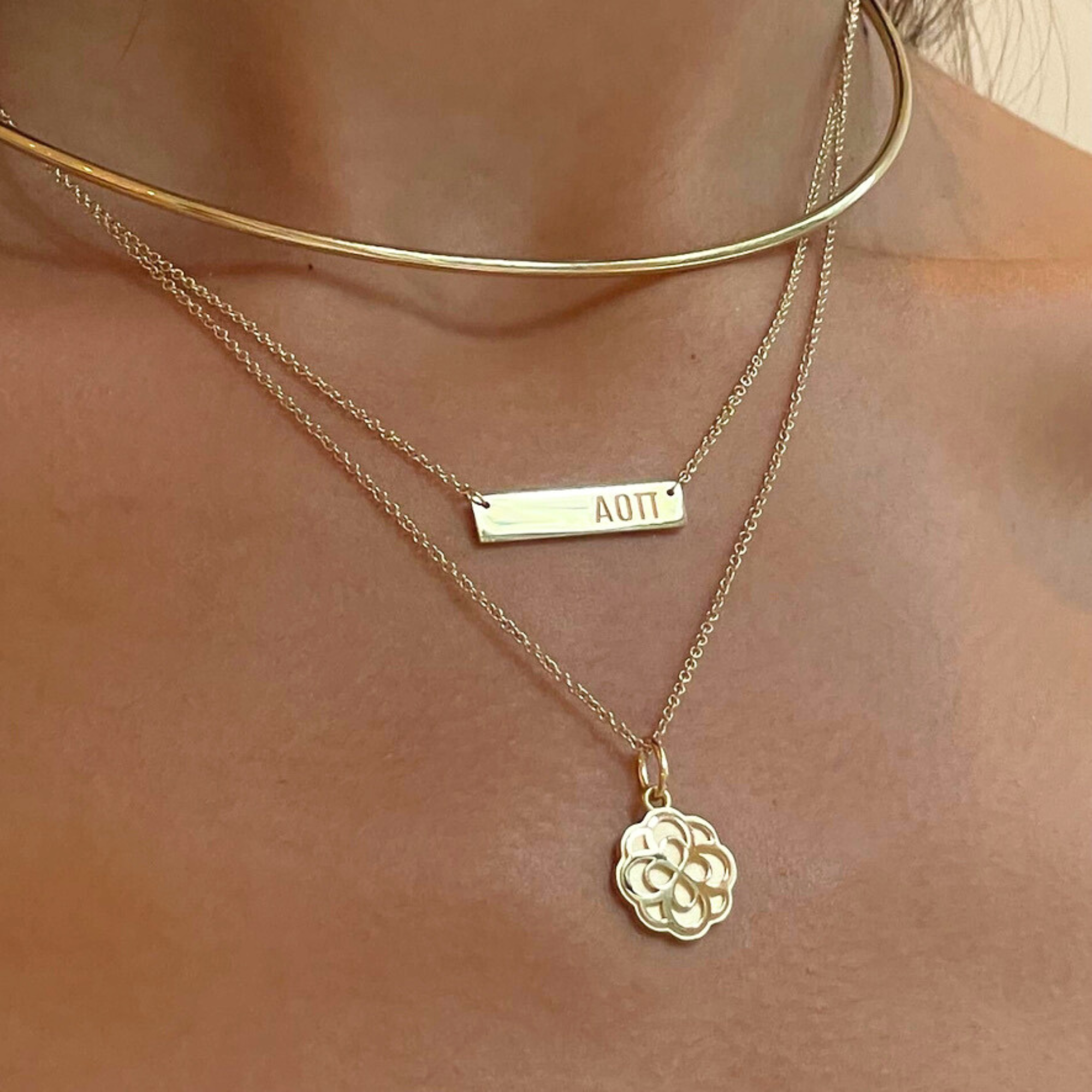 Alpha Omicron Pi Rose Charm on figure