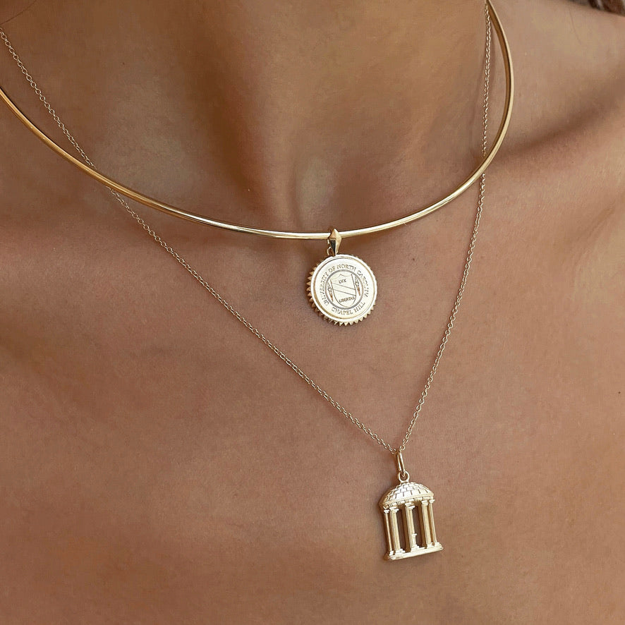 UNC Sunburst Pendant on figure