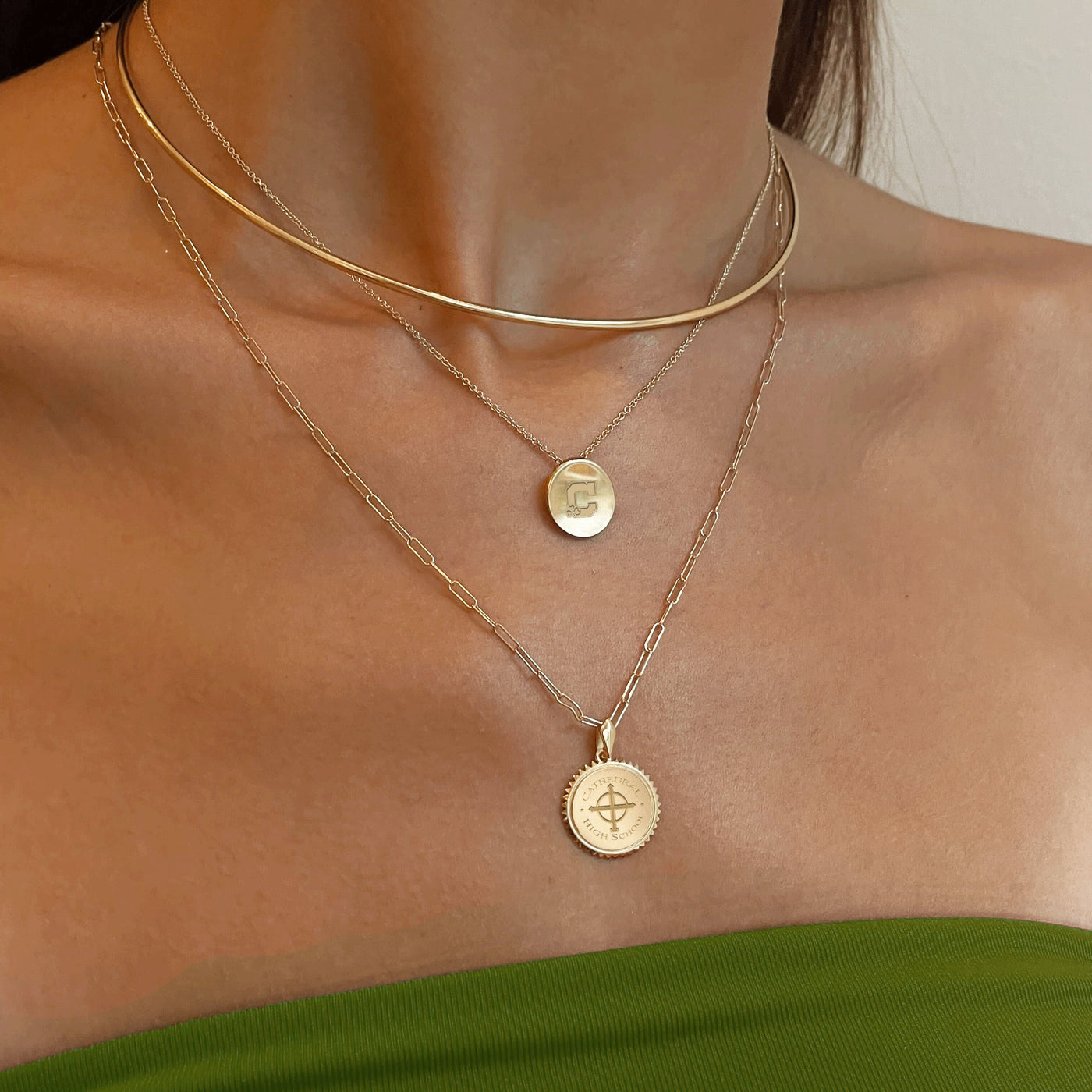 Cathedral Logo Necklace shown on figure in gold with Cathedral Sunburst Pendant on Link Chain, and Neck Collar in gold