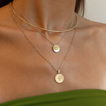 Cathedral Logo Necklace shown on figure in gold with Cathedral Sunburst Pendant on Link Chain, and Neck Collar in gold