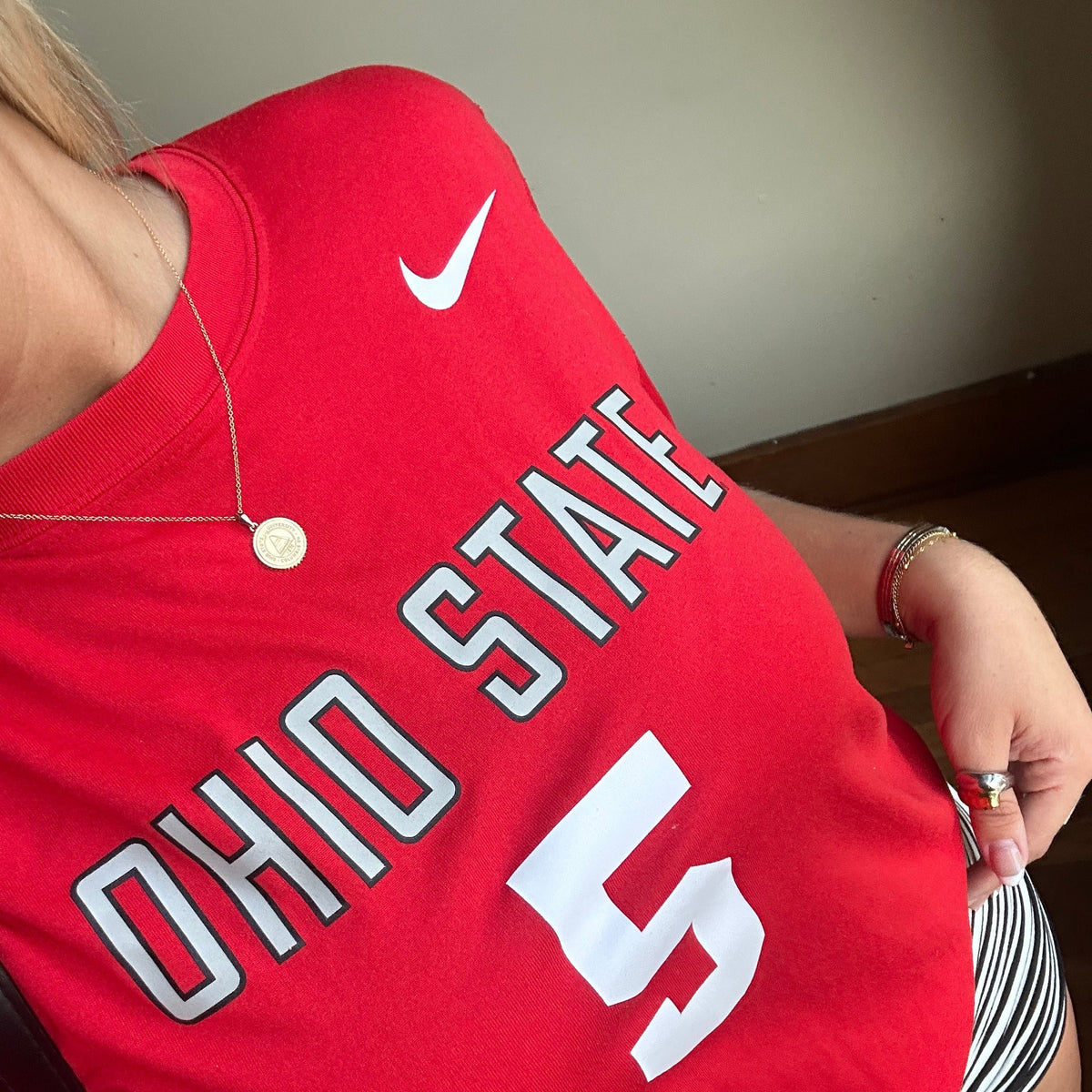 Ohio State Sunburst Pendant shown on figure in gold on Cable Chain