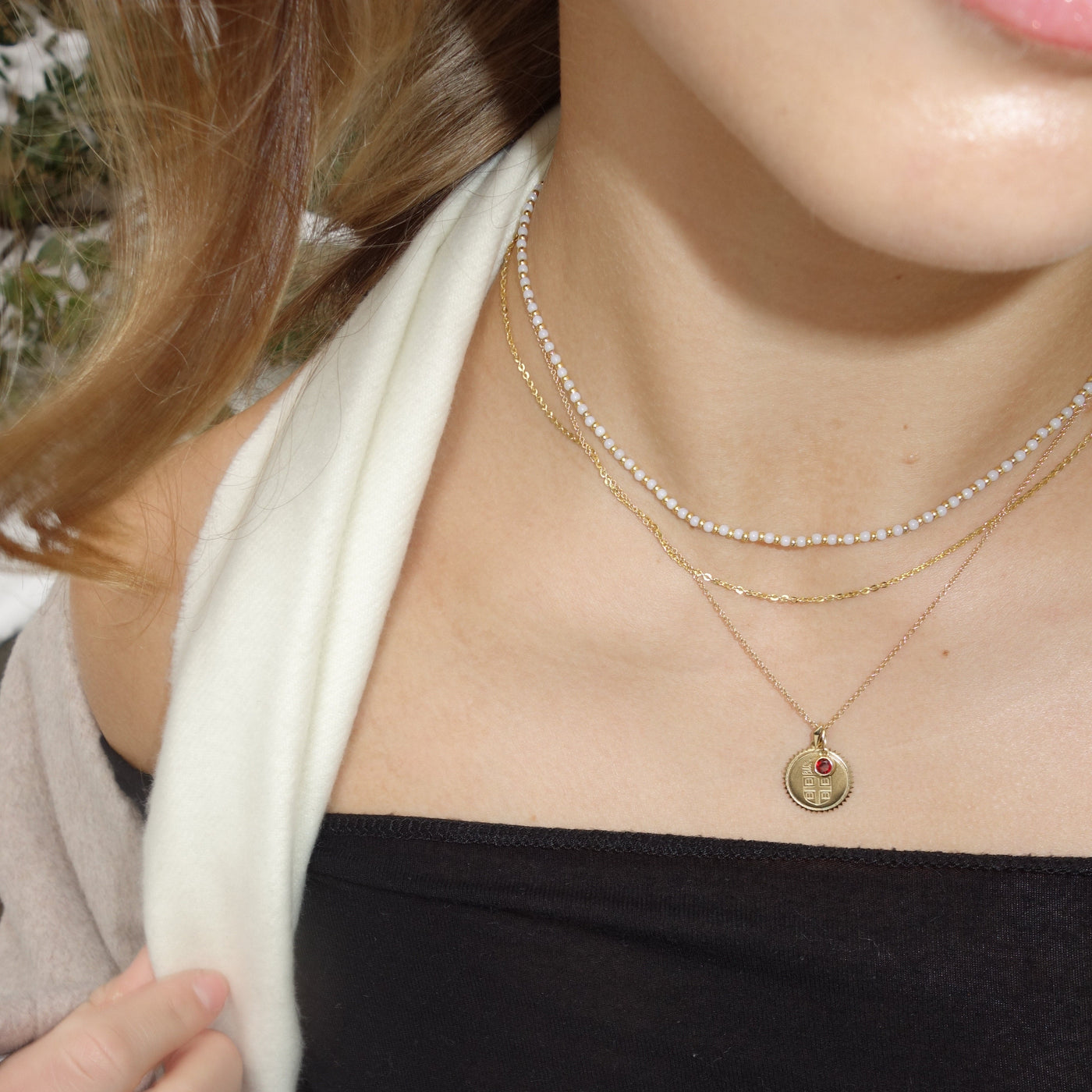 Brown Sunburst Bundle shown on figure in gold