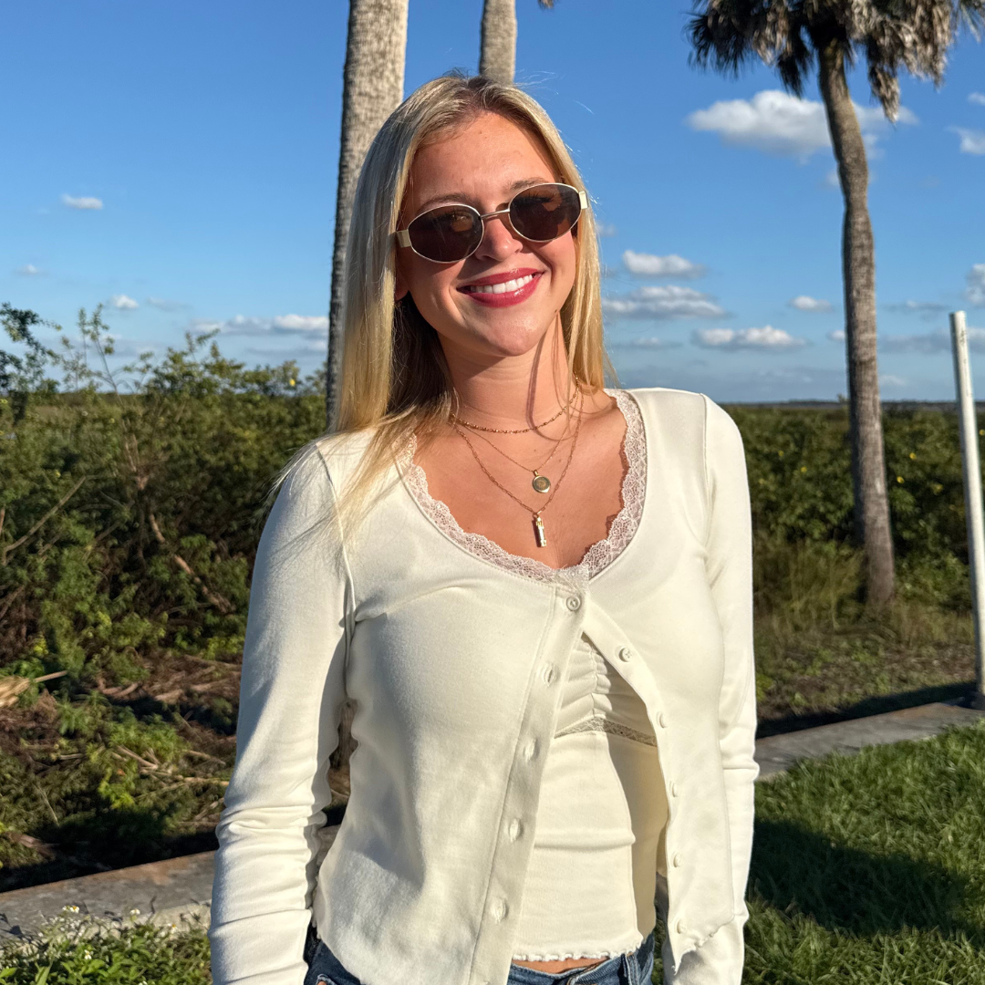 Florida Century Tower Pendant shown on figure in gold on Cable Chain with Florida Seal Sunburst Pendant on Cable Chain