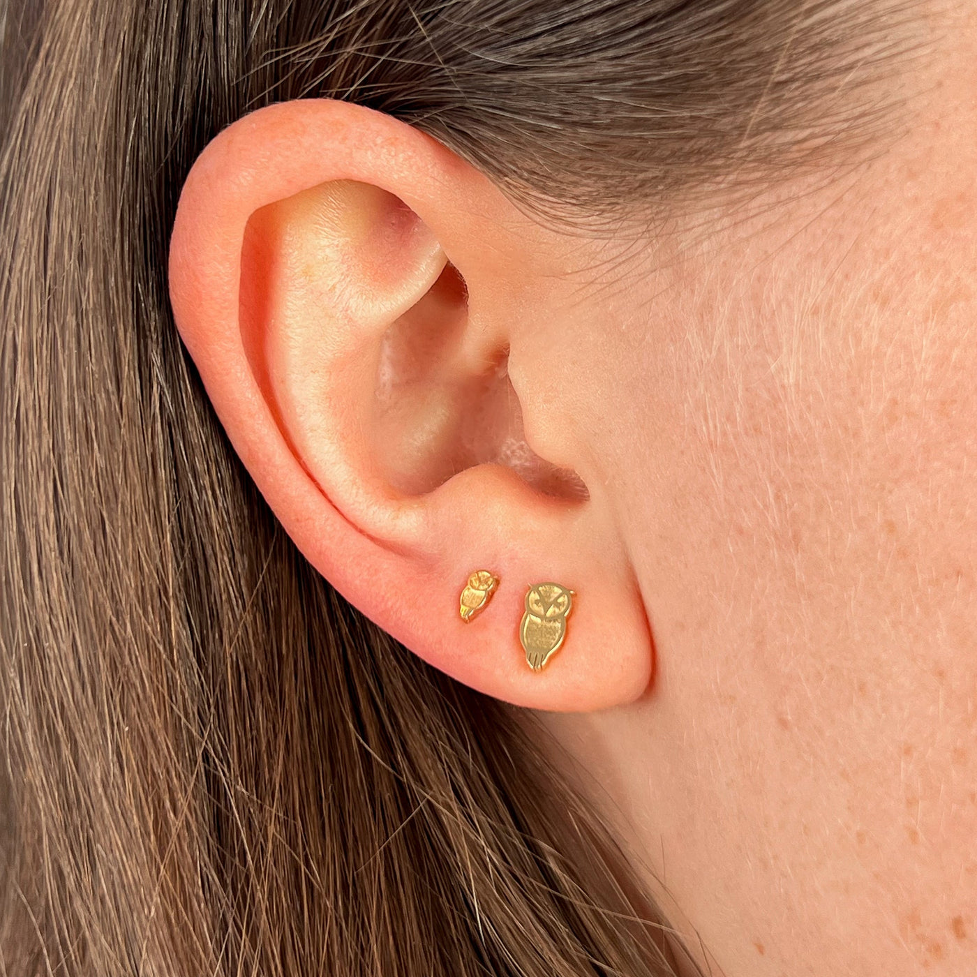 Chi Omega Owl Stud Earrings shown on figure in gold in size 5mm and size 8mm