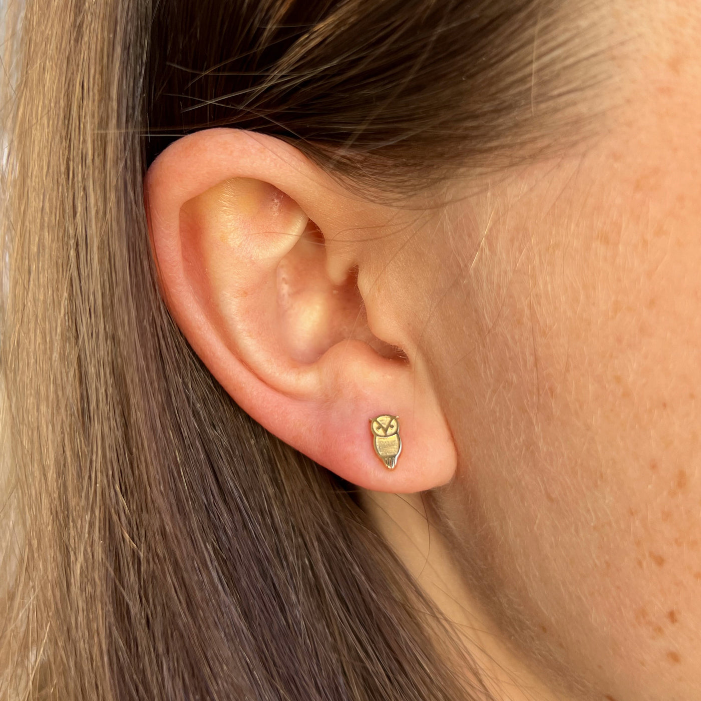Chi Omega Owl Studs shown on figure in gold in size 5mm