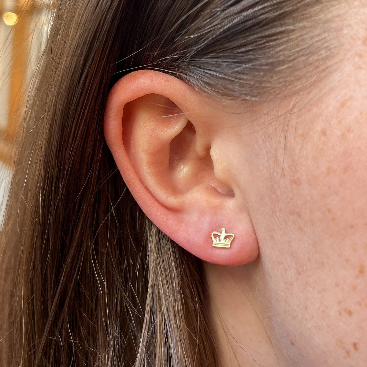 Columbia Crown Stud Earring shown on figure in gold