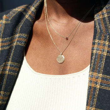 Cornell 7-Point Diamond Necklace shown on figure with Garnet Gemstone Necklace