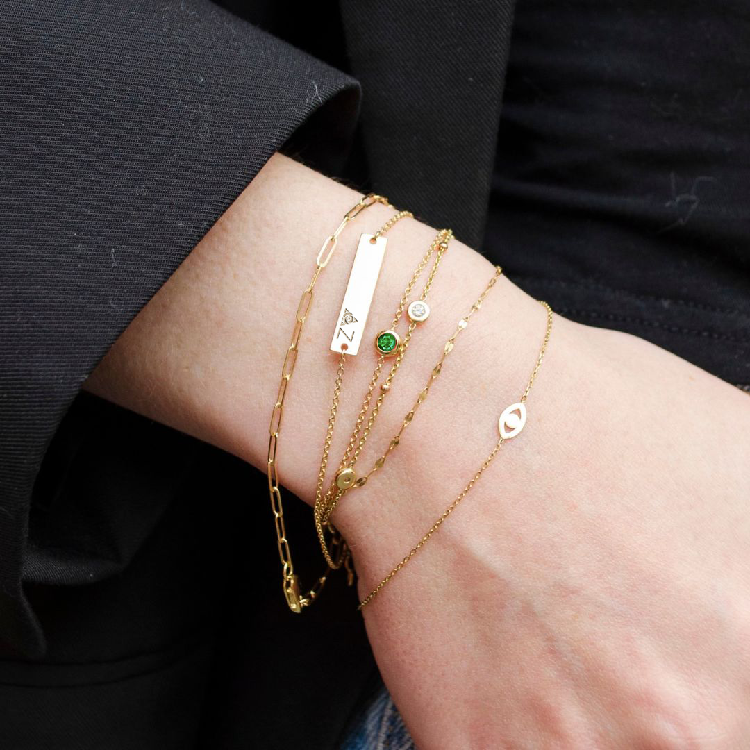 Delta Zeta Bracelet Bundle shown on figure in gold with Emerald Gemstone Bracelet