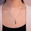 Delta Zeta Vertical Wide Bar shown on figure in gold on Link Chain