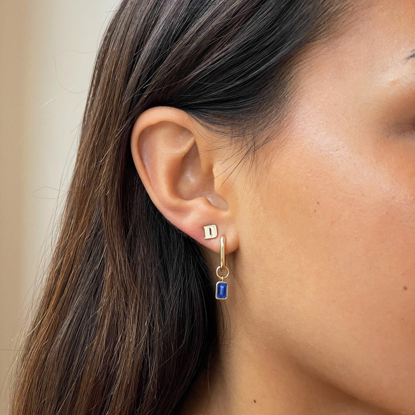 Duke D Sapphire Mini U Earring Bundle shown on figure in gold