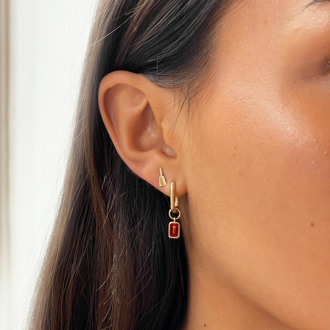 Mississippi State Cowbell Mini U Earring Bundle shown on figure in gold