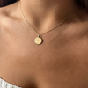 FSU Florentine Pendant shown on figure in gold in Petite size on Cable Chain