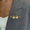 FSU Spear Lapel Pin shown on figure in gold