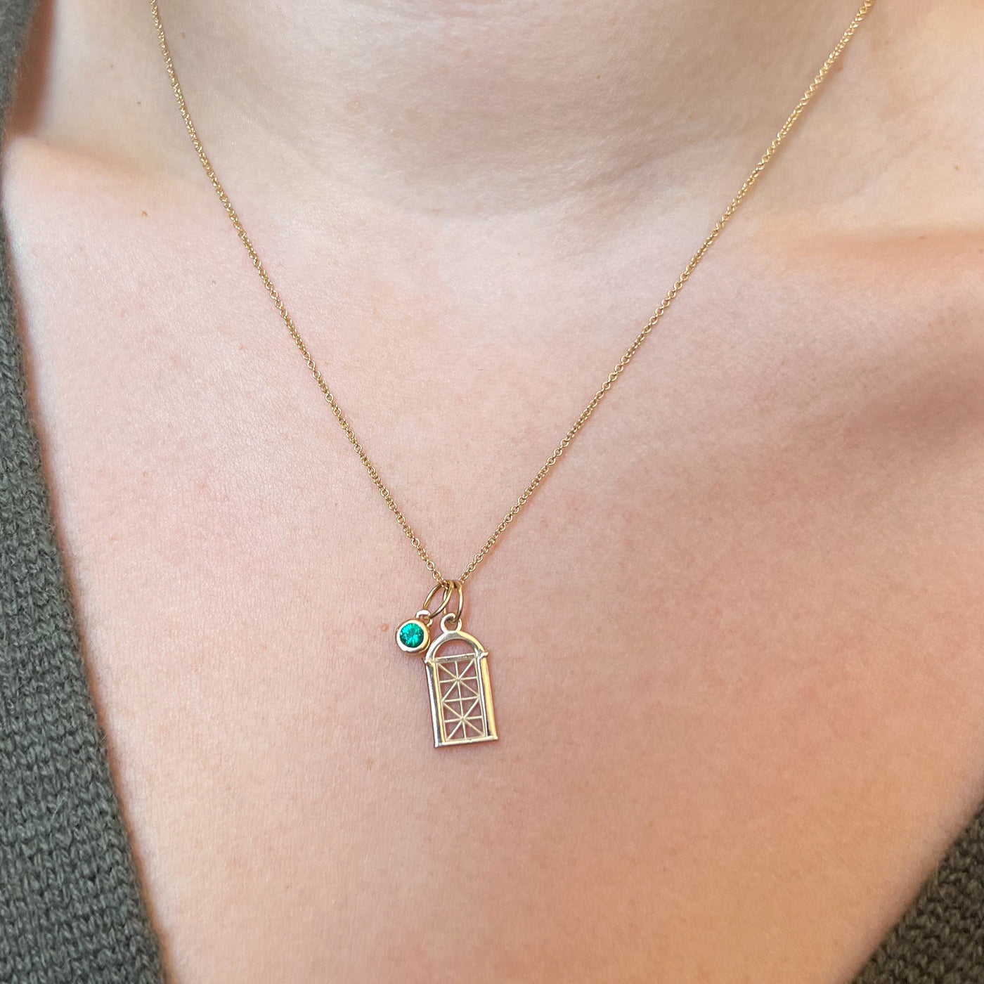 Georgetown Visitation Gate Bundle shown on figure in gold