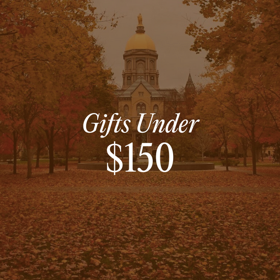 Gifts Under $150 graphic linking to Gifts Under $150 collection with photo of Notre Dame Golden Dome in the background