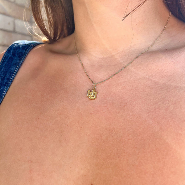 Utah Logo Charm shown on figure in gold on Cable Chain