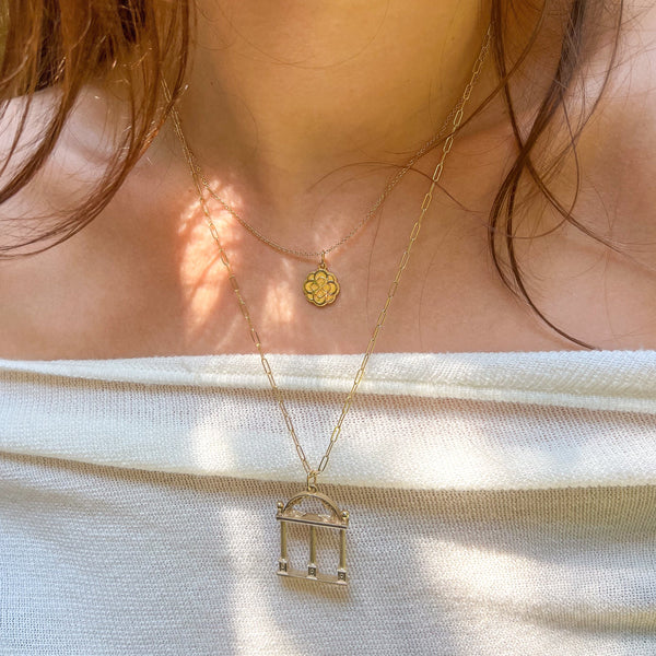 Alpha Omicron Pi Rose Charm shown on figure in gold with Cable Chain