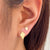 Kappa Alpha Theta Kite Stud Earring shown on figure in gold in 2 sizes