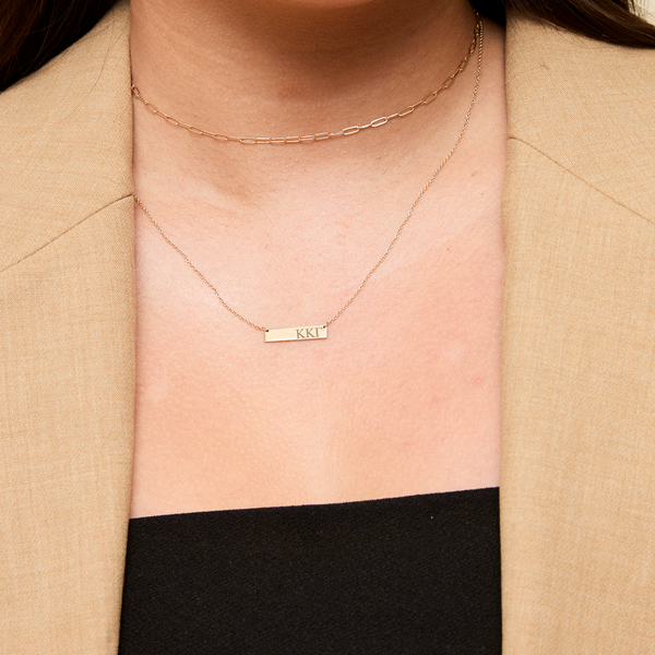 Kappa Kappa Gamma Letters Horizontal Bar Necklace shown on figure in gold with Link Chain Choker