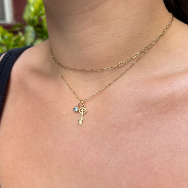 Kappa Kappa Gamma Key Charm on figure layered with Cable Chain and Blue Topaz Gemstone