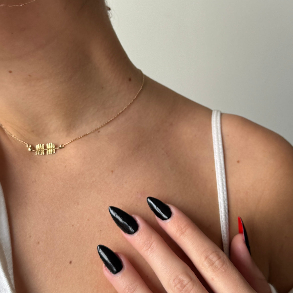 FSU Spear Necklace shown on figure in gold
