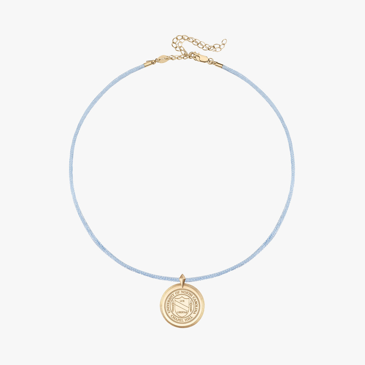 A delicate light blue cord necklace with a gold-toned circular pendant and extension chain, displayed on a clean off-white background.