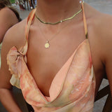 Ole Miss Eye Seal Sunburst Pendant shown on figure in gold on Cable Chain