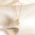 Michigan Florentine Crest Necklace Petite shown in gold laydown