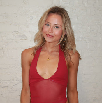 Nebraska Sunburst Pendant shown on figure in gold on Cable Chain