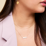 Marquette Bar Necklace shown on figure in gold