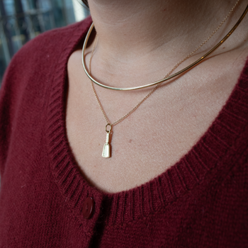 Mississippi State Cowbell Charm shown on figure in gold on Cable Chain with Neck Collar in gold