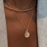 North Star Line Bar Charm shown on figure in gold with Penn State Sunburst on Cable Chain and Neck Collar in gold