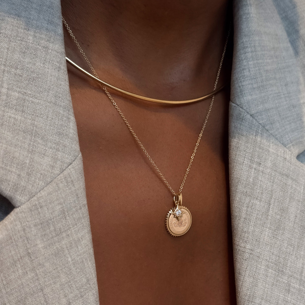 North Star Charm shown on figure in gold with Penn State Sunburst Pendant on Cable Chain with Neck Collar in gold