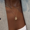North Star Disc Charm shown on figure in gold with FSU Sunburst Pendant on Cable Chain with Neck Collar