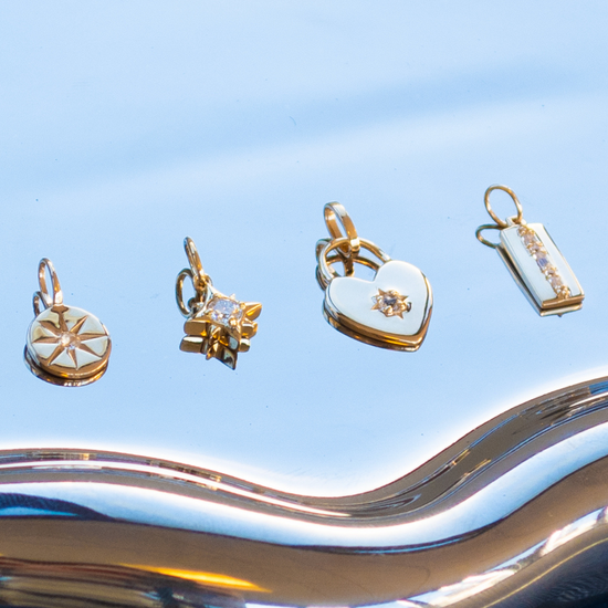 Set of gold pendants on a blue background